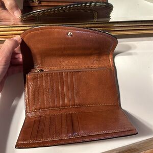 Michael Kors leather wallet used with wear and tear shown in video..